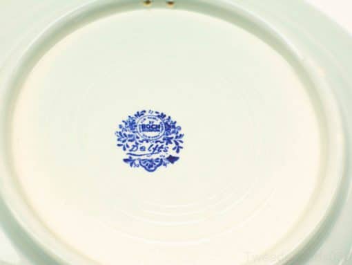 Vintage Delfts ceramic plate with Bogen makers mark, showcasing blue floral design charm.