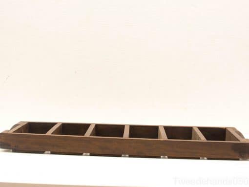Elegant wooden tray with seven compartments for stylish organization in home or office.