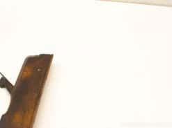 Elegant vintage wooden firearm showcasing rich grain and craftsmanship, perfect for collectors.