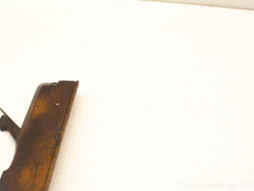 Elegant vintage wooden firearm showcasing rich grain and craftsmanship, perfect for collectors.
