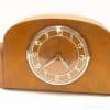 Elegant vintage wooden tabletop clock with classic design and cream numbers for timeless decor.