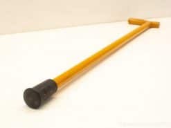 Elegant wooden cane with T-handle and rubber tip for support and style.