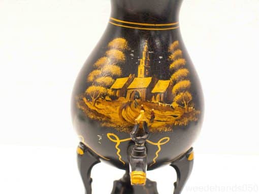 Elegant vintage vase featuring a tranquil landscape painting and robust black stand.