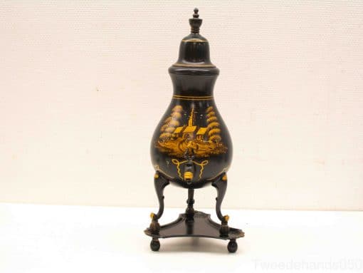 Elegant black urn featuring a stunning golden landscape design, ideal for decoration or collection.
