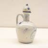 Elegant blue and white ceramic pitcher with intricate designs, perfect for decoration or utility.