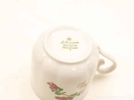Elegant J. L. Menau porcelain mug from West Germany with hand-painted floral design.