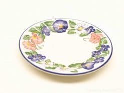 Vibrant floral decorative plate, perfect for display and versatile use in any table setting.