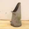 Vintage metal container with rustic charm, perfect for watering or decorative purposes.