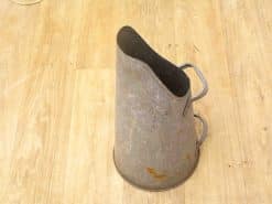 Vintage galvanized milk jug with conical shape, tarnished finish, and rustic charm.