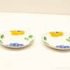 Colorful hand-painted ceramic plates perfect for cheerful dining and decorative table settings.