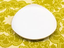 Elegant white plate with a golden rim, perfect for stylish dining or decorative use.