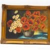 Vibrant floral painting with red poppies and white daisies in an ornate golden frame.