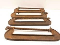 Vintage set of 4 rusted C-clamps, essential tools for woodworking and metalworking projects.