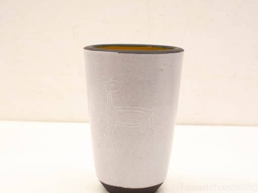 Elegant ceramic vase with deer engraving, soft white finish and vibrant amber interior.