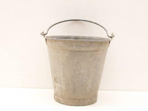 Classic galvanized metal bucket with handle, perfect for gardening and everyday tasks.