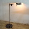 Sleek modern floor lamp with unique adjustable shade for stylish, ambient lighting.