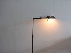 Modern adjustable floor lamp with warm light for a cozy, contemporary living space.