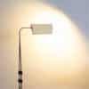 Elegant modern floor lamp with geometric shade for a minimalist and functional space.