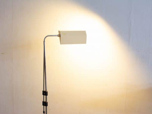 Elegant modern floor lamp with geometric shade for a minimalist and functional space.