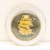 Elegant sailing ship decorative plate with gold accents and nautical theme, perfect for collectors.