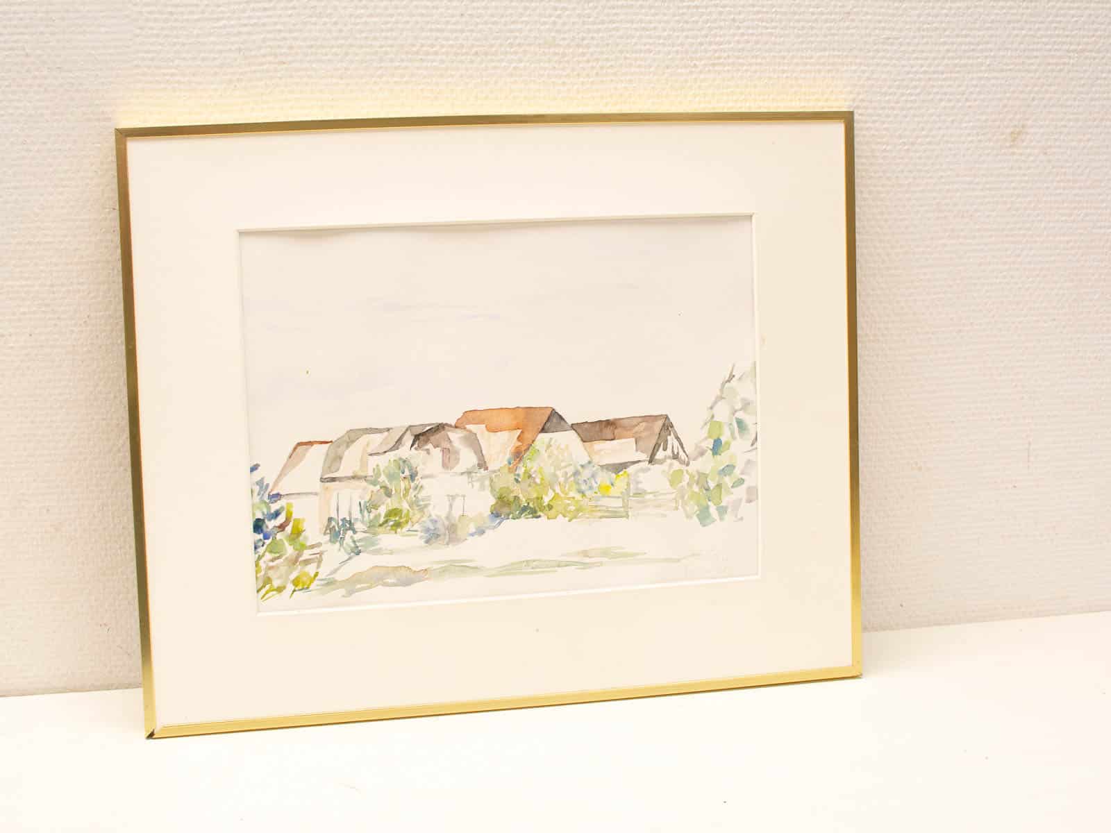 Tranquil watercolor painting of charming houses in a serene rural landscape.