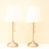 Elegant modern white pleated table lamps with sleek metallic bases for stylish home decor.