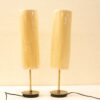 Stylish modern table lamps with woven shades and brass bases, perfect for any interior.