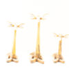 Charming trio of vintage wooden giraffe sculptures, perfect decor for animal lovers.