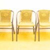Stylish yellow woven chairs with gray frames for home and garden gatherings.