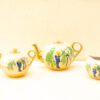 Charming vintage tea set with bamboo motif in glossy porcelain, perfect for collectors and tea lovers.
