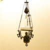 Antique hanging lamp with vibrant colors and glass shade, perfect for vintage decor.