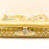 Antique decorative box with painted lid, intricate design, and ornate clasp for elegant storage.