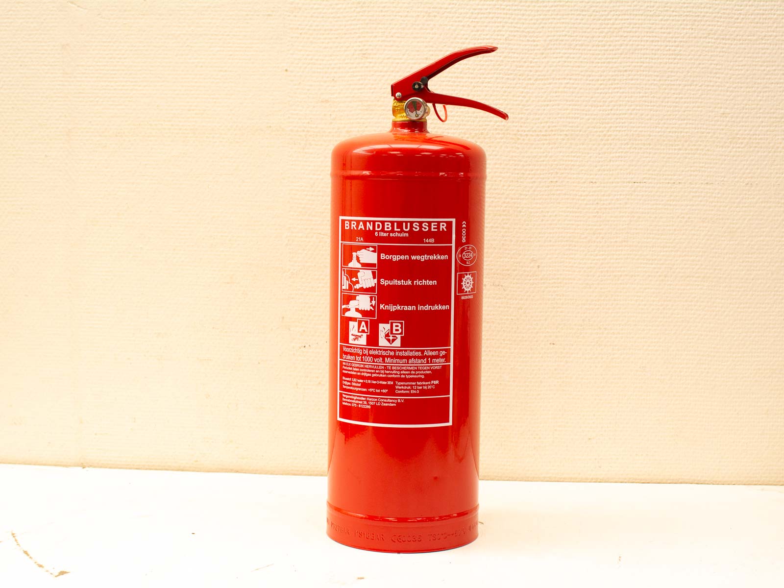 Classic red fire extinguisher for safety, featuring clear instructions and durable design.