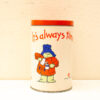 Playful vintage tin canister with colorful design, perfect for tea or decorative storage.
