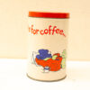 Charming vintage coffee canister with whimsical design and cozy character illustration for kitchen decor.