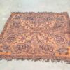 Stunning vintage Persian shawl in vibrant orange and purple, featuring intricate floral patterns.