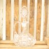 Elegant vintage glass decanter on rustic wood, perfect for wine or home decor.