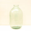 Vintage green glass jar with a unique bulbous shape, perfect for decor or storage.