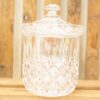 Elegant vintage glass jar with lid, perfect for storage or as a decorative accent.