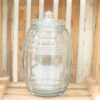 Elegant glass jar on rustic wooden crate, perfect for vintage decoration and stylish storage.
