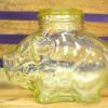 Charming vintage pig jar for storage and decoration, adding whimsy to any space.