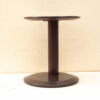Sleek modern round table with polished dark finish, ideal for stylish living spaces and offices.