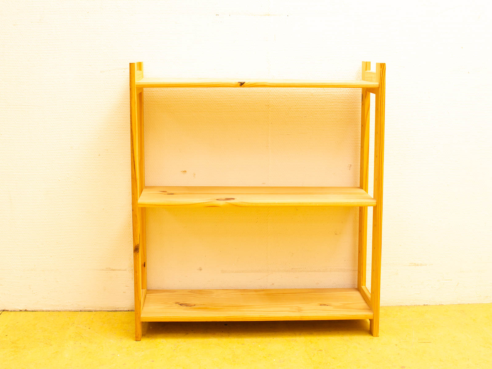 Stylish light wood shelf for decor and storage, perfect for home or office use.