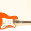 Vibrant orange electric guitar blending classic and modern styles, perfect for any musician.