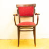 Elegant vintage wooden chair with red upholstery, combining comfort and style for any decor.