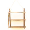Rustic wooden wall shelf with three curved tiers, perfect for displaying decor and plants.