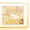 Antique Caspian Sea map: vibrant colors, detailed regions, and artistic illustrations in gold frame.