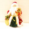 Charming vintage Santa Claus decoration with gifts, perfect for festive holiday decor.