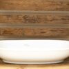 Elegant white ceramic dish on rustic wooden shelf, perfect for kitchen decor and decorative accents.