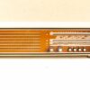 Vintage Loewe Opta Radio: Classic design with warm tones and intuitive controls for retro enthusiasts.